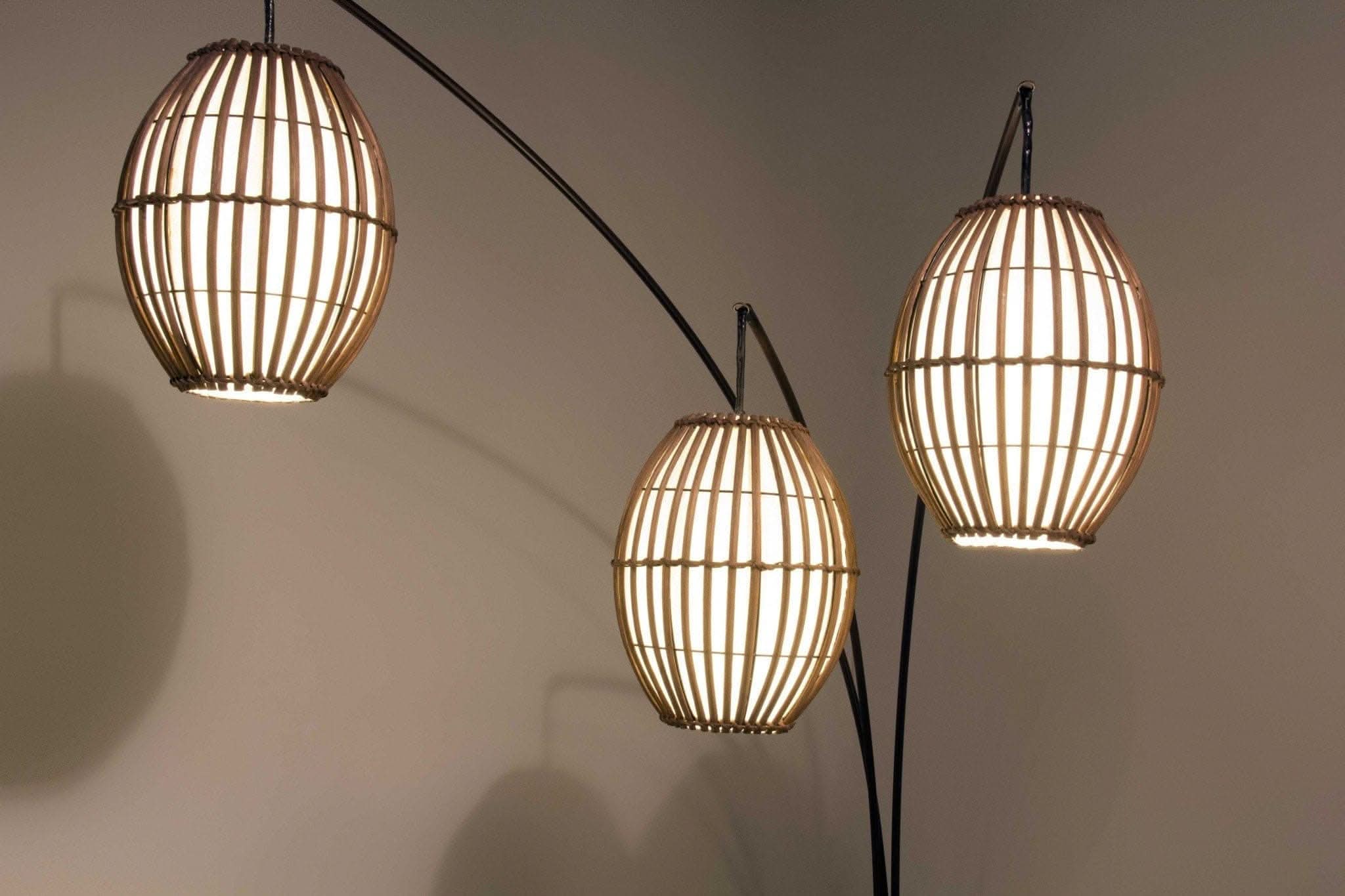 Bronze three-light arc lamp with brown cane barrel lanterns